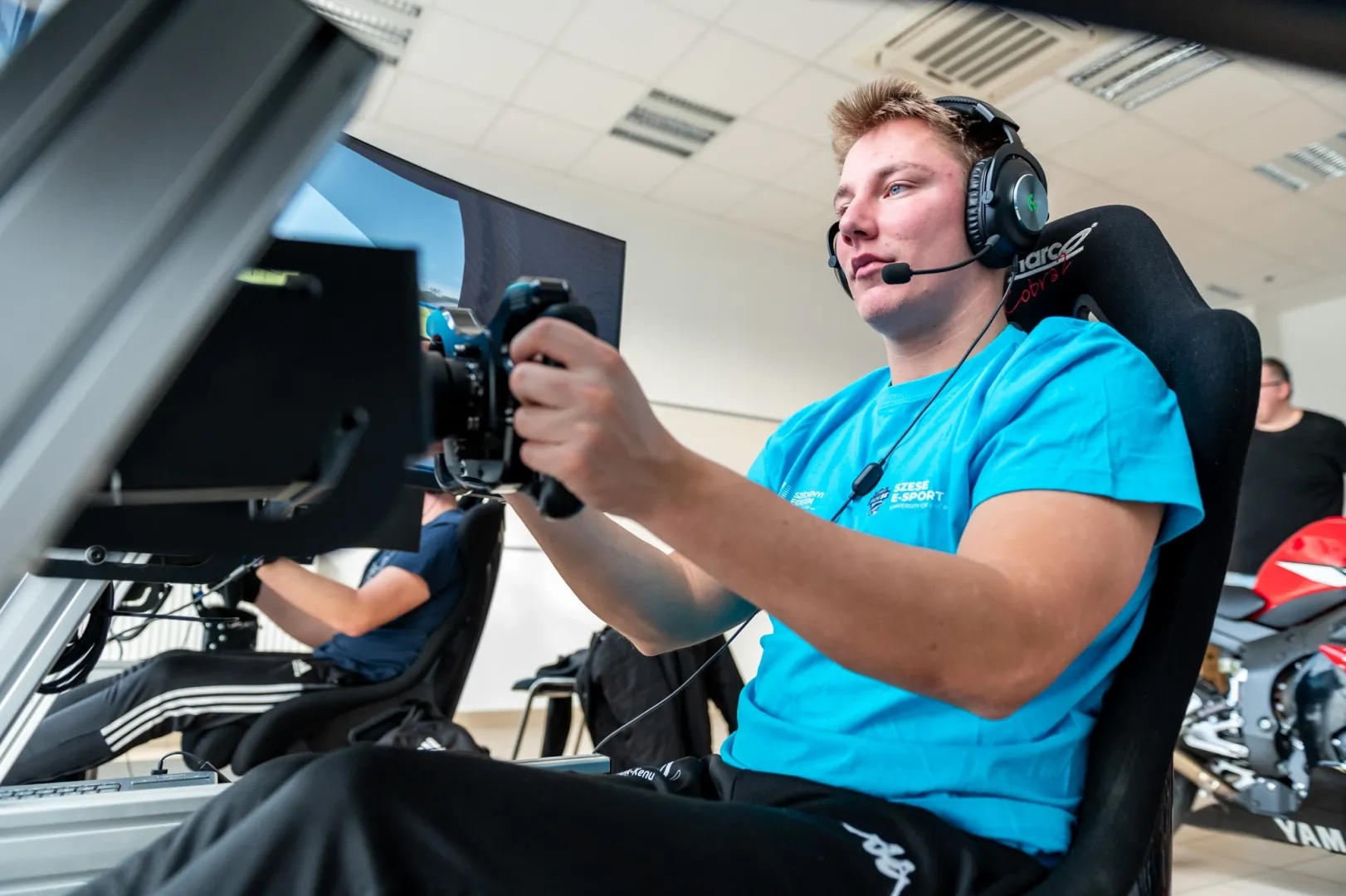 Balázs Pálla represents Széchenyi István University as a professional simulator racer in the SZESE E-Sport (Pro) team while also pursuing his studies in agricultural and food industry mechanical engineering at the institution. (Photo: Máté Dudás)